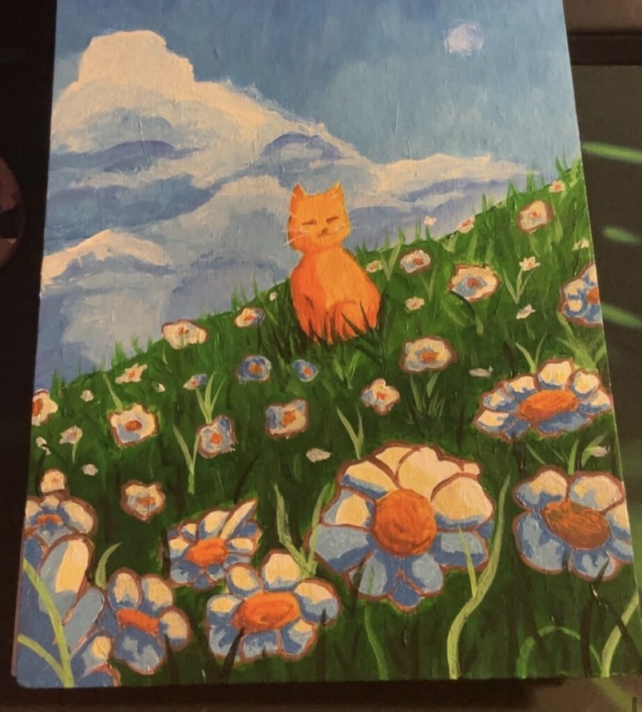 værk af Katrines kat Otto på en blomster mark